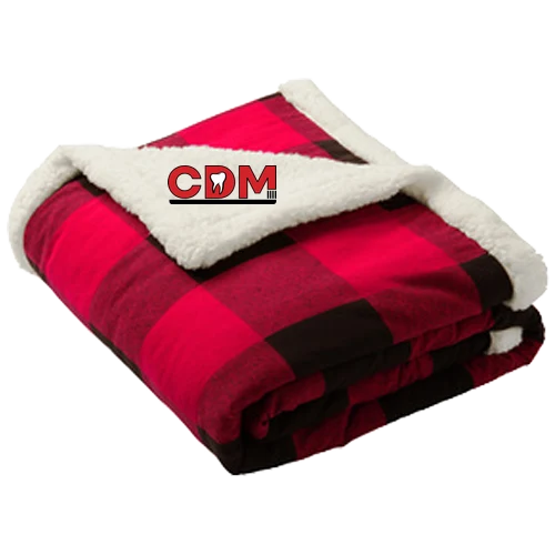 Buffalo plaid sherpa blanket with the CDM logo